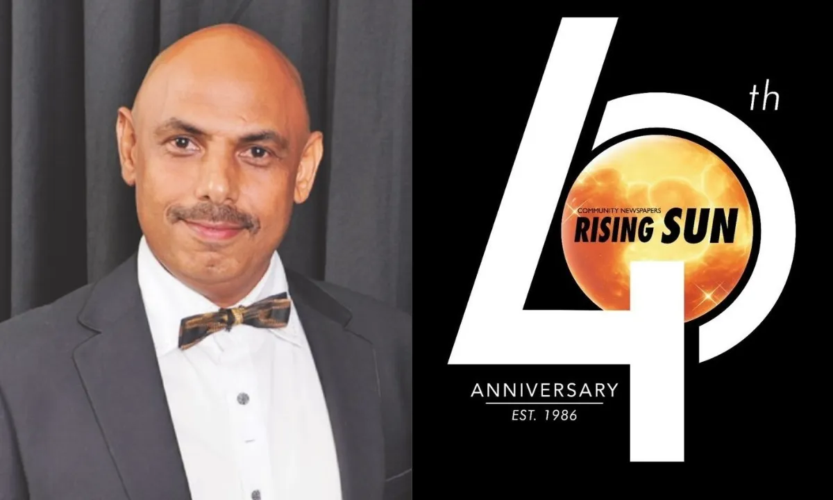 Vijay Maharaj of the rising sun newspaper in a tuxedo